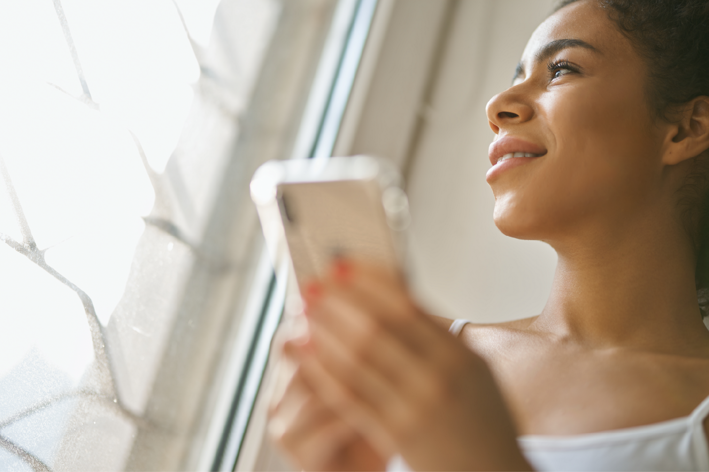 Person holding a mobile, happy and showing wellness goals, activity tracking, and daily reports and reading